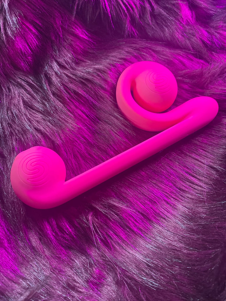 A pink sex toy that looks like a snail.